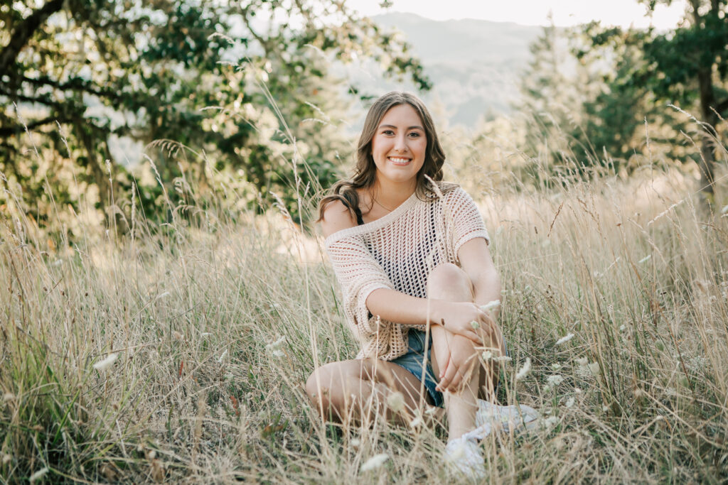 A high school senior poses for senior pictures at Fitton Green in Corvallis