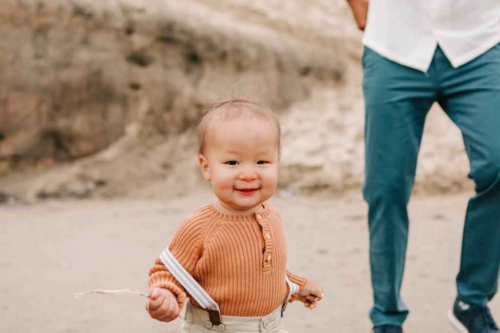 toddler boy smiling naturally during senior session with Jen White Photography in Oregon