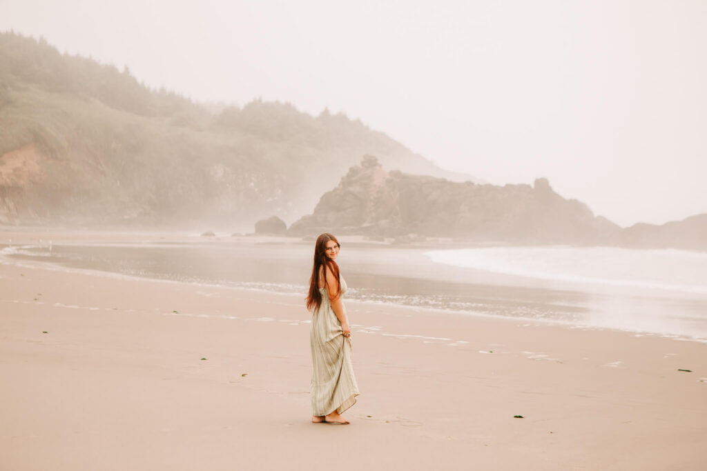 A high school senior walks on the beach at Foggarty Creek in Lincoln City