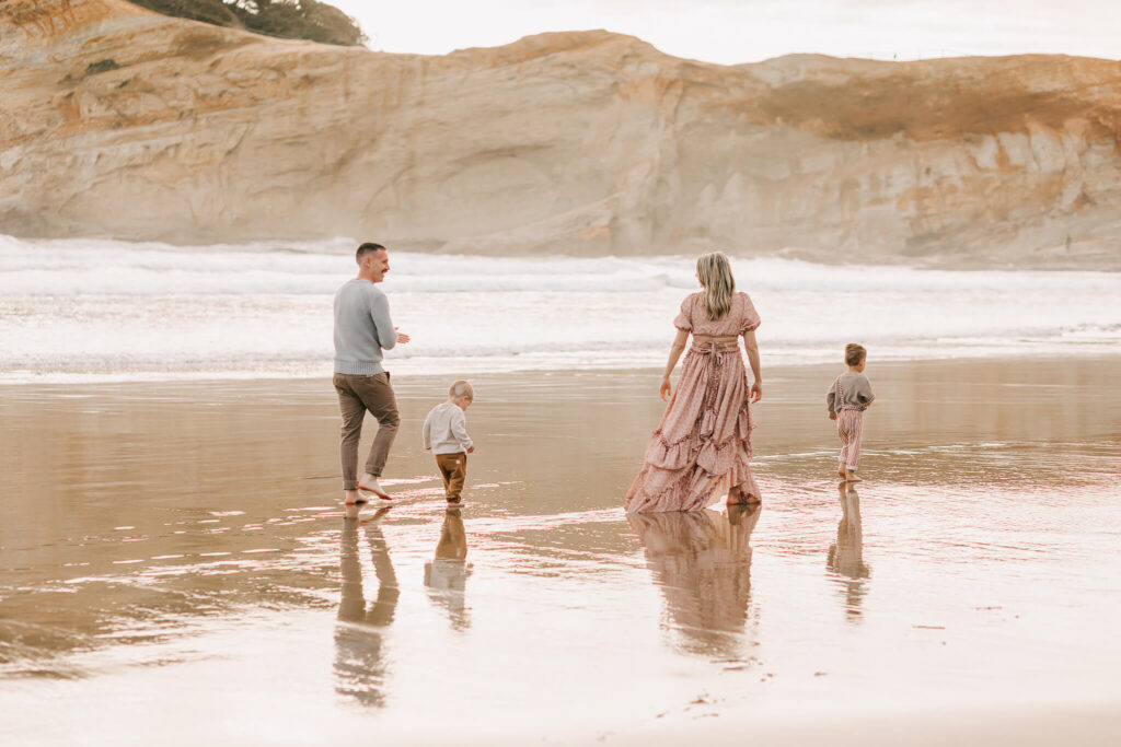 Family walks together on and Oregon beach 