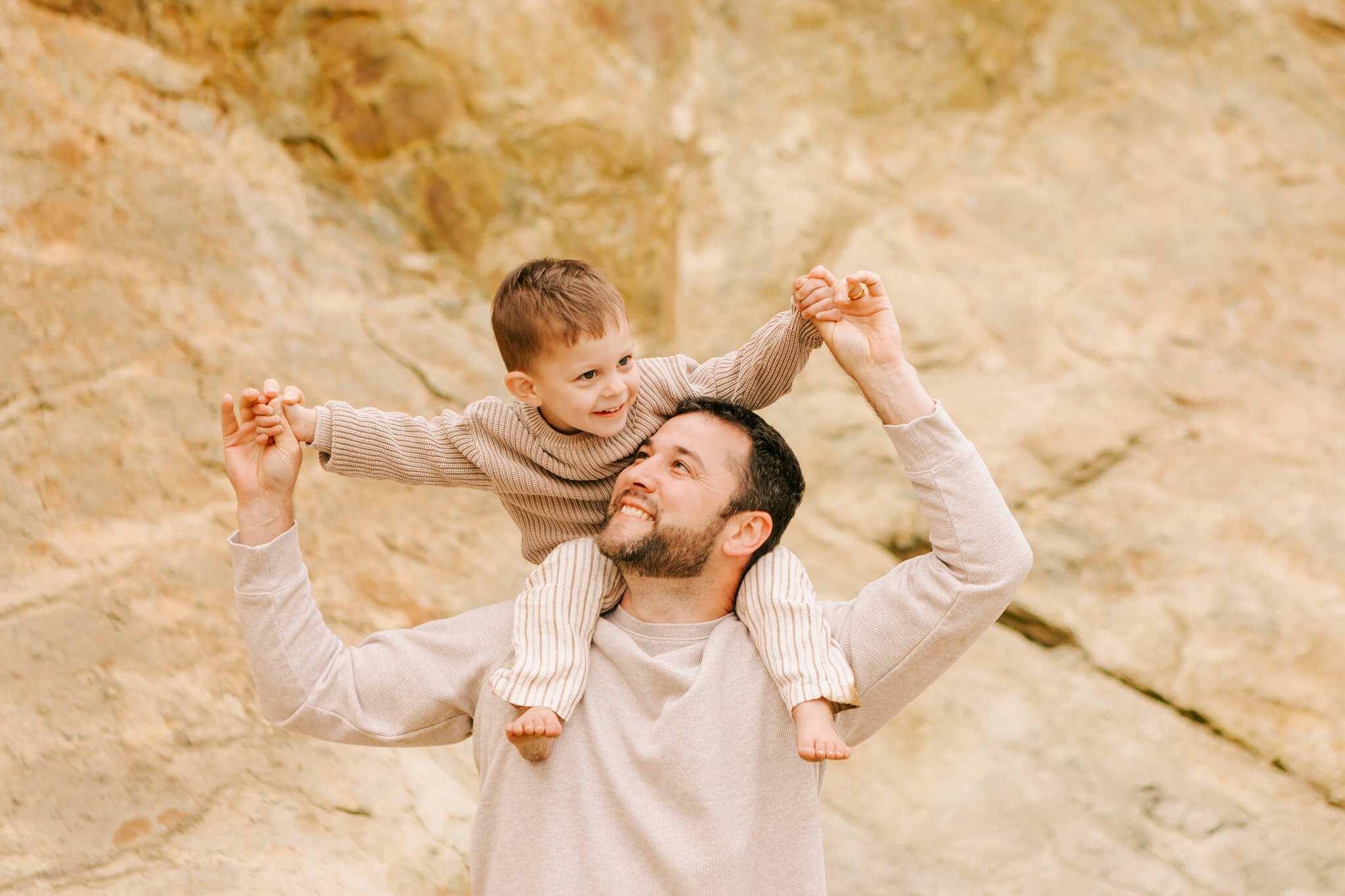Father and son playing at Cape Kiwanda on the Oregon Coast
